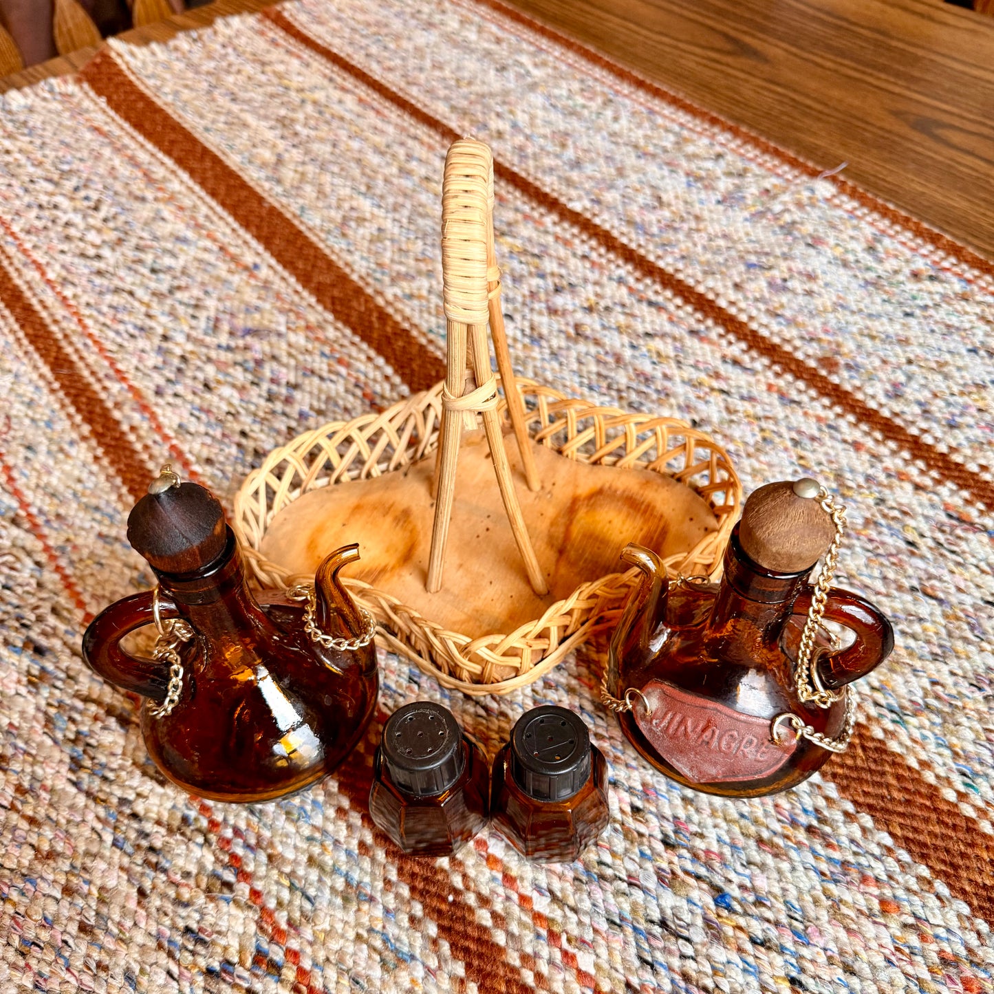 Vintage Spanish Amber Glass Oil and Vinegar Cruet Bottles with Salt and Pepper Shakers in Wicker Caddy