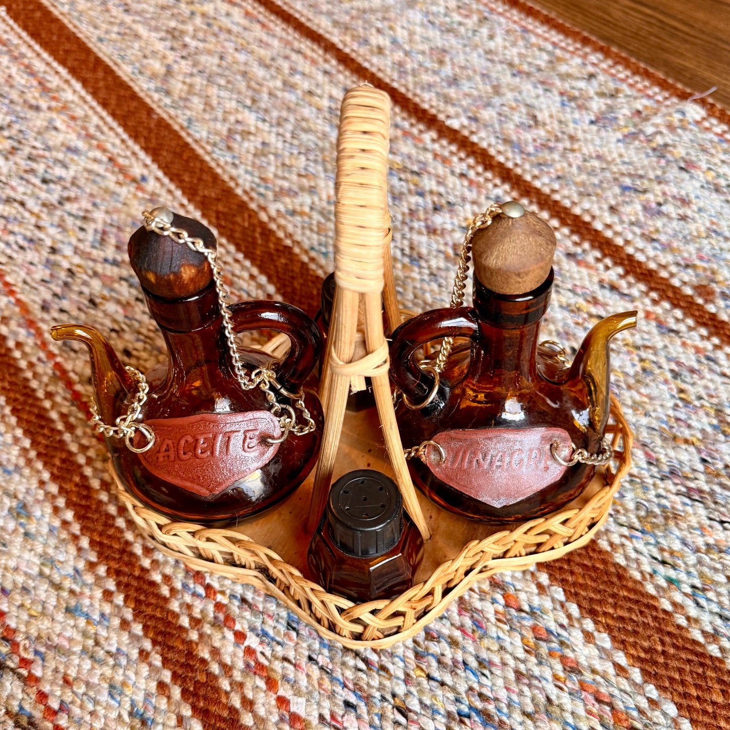Vintage Spanish Amber Glass Oil and Vinegar Cruet Bottles with Salt and Pepper Shakers in Wicker Caddy