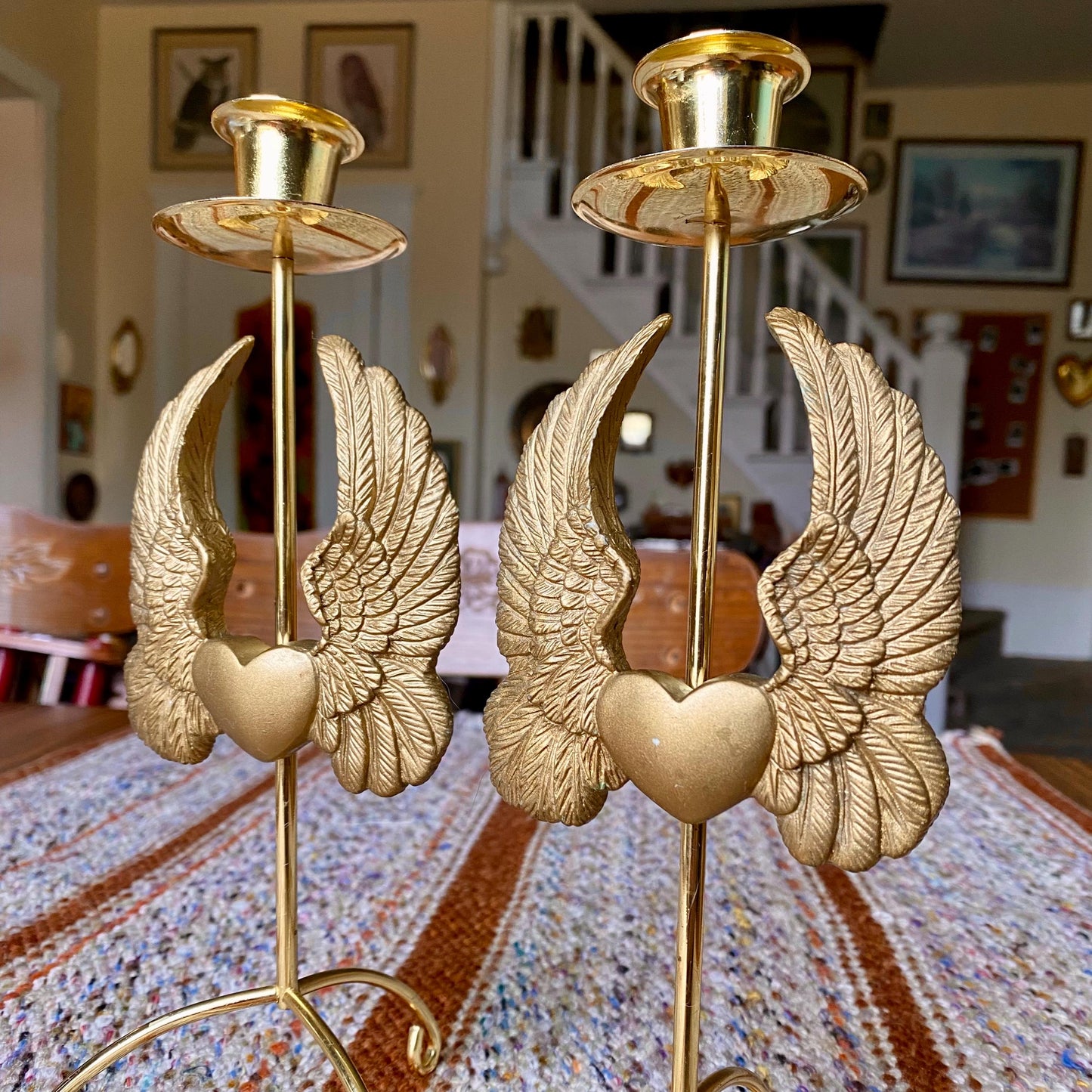 Set of Two Vintage Brass Pillar Candle Holders Adorned with Ornate Hearts with Wings