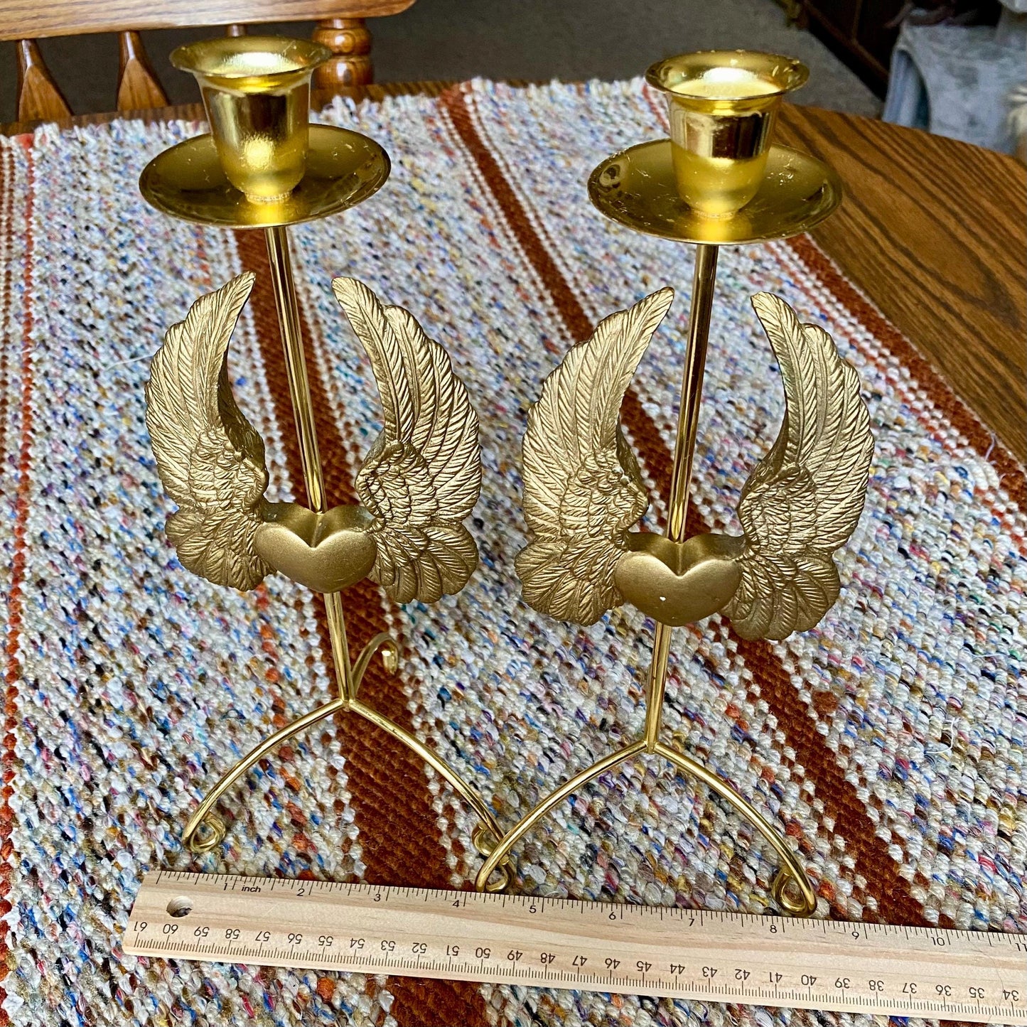 Set of Two Vintage Brass Pillar Candle Holders Adorned with Ornate Hearts with Wings